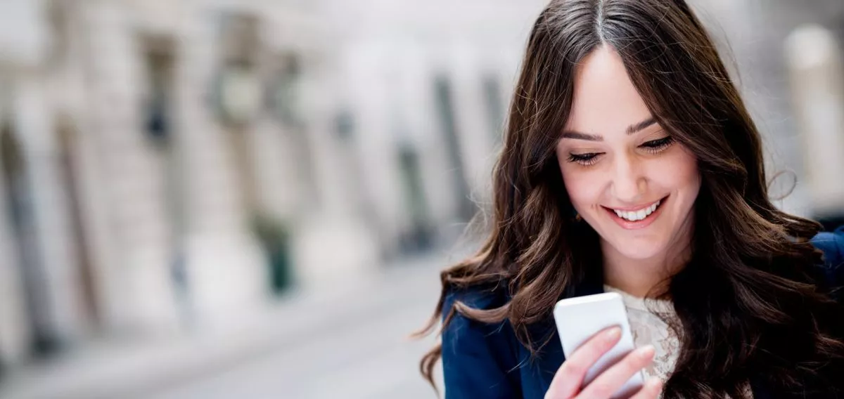 Smiling Woman with mobile phone