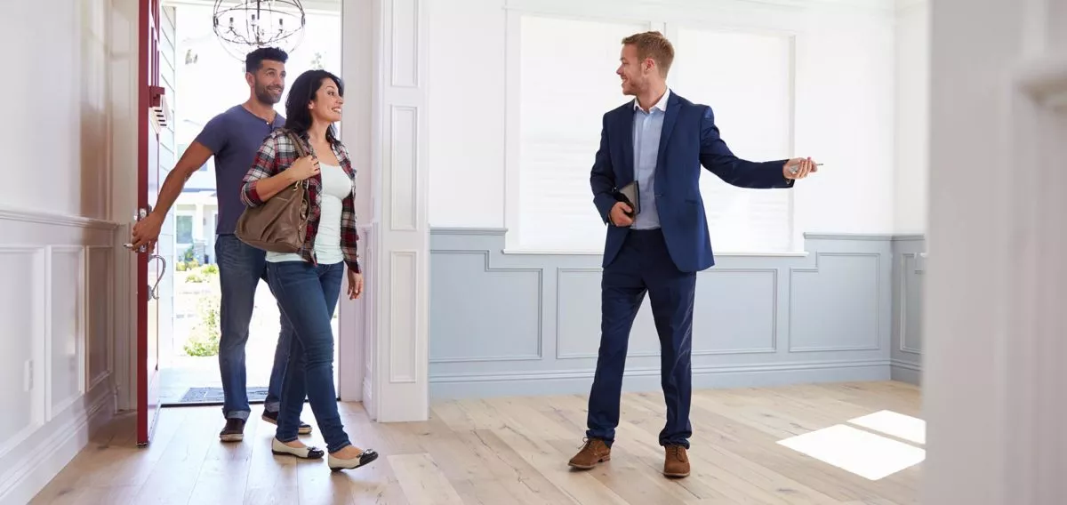 Realtor showing home to couple