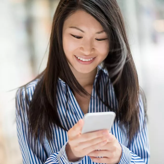 woman looking at smartphone