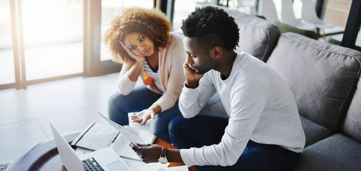 Young couple discussing finances.