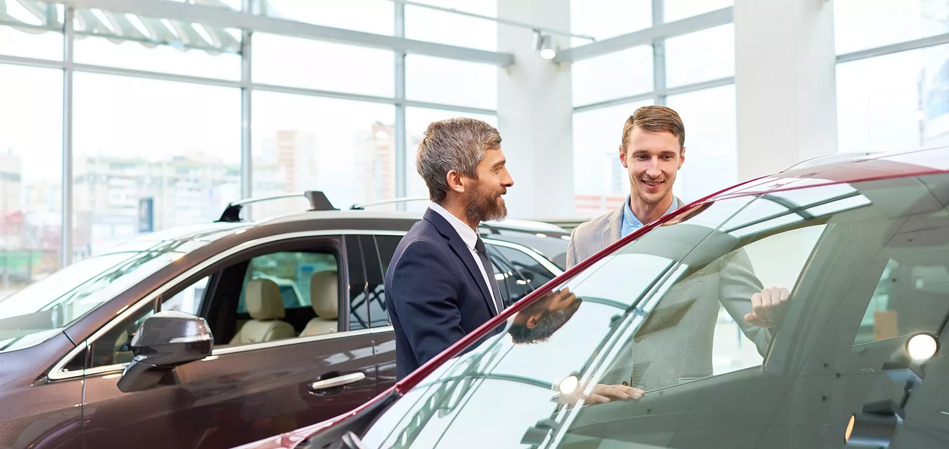 Man buying car at dealership
