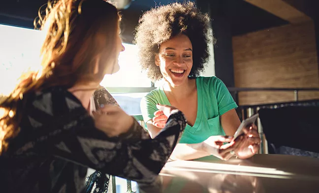 women chatting at a table