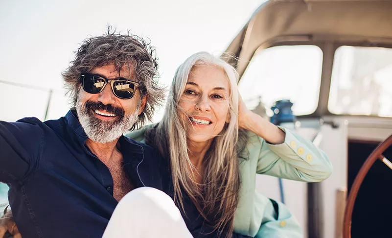 couple smiling on a boat