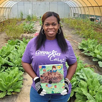 image of connexus cares volunteer in garden