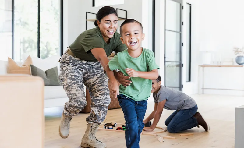 veteran woman chasing son around the house