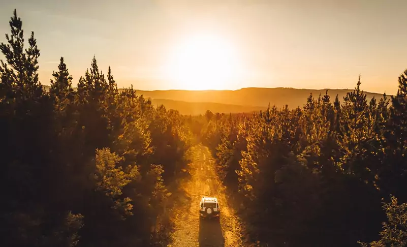 truck driving into the sunset