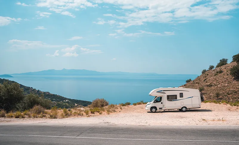 photo of rv by a beach