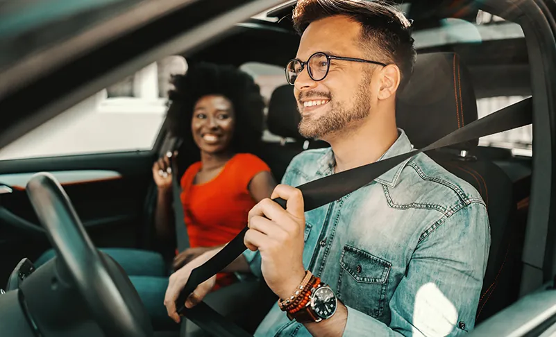 couple smiling in car
