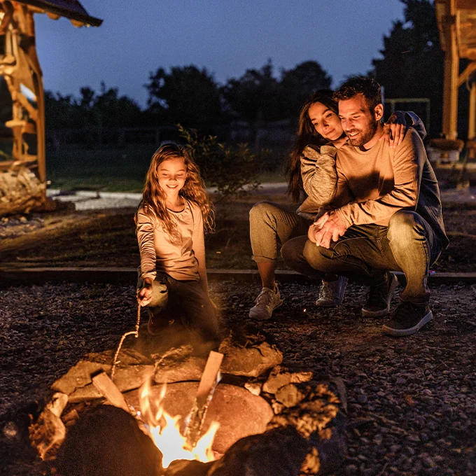 family enjoying a campfire