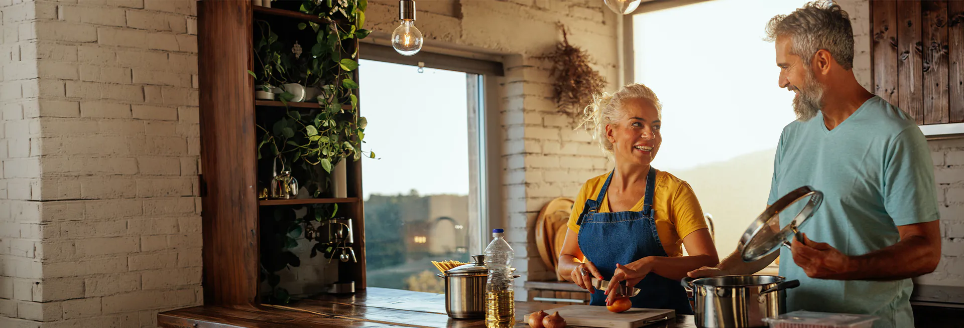 couple cooking together during the evening
