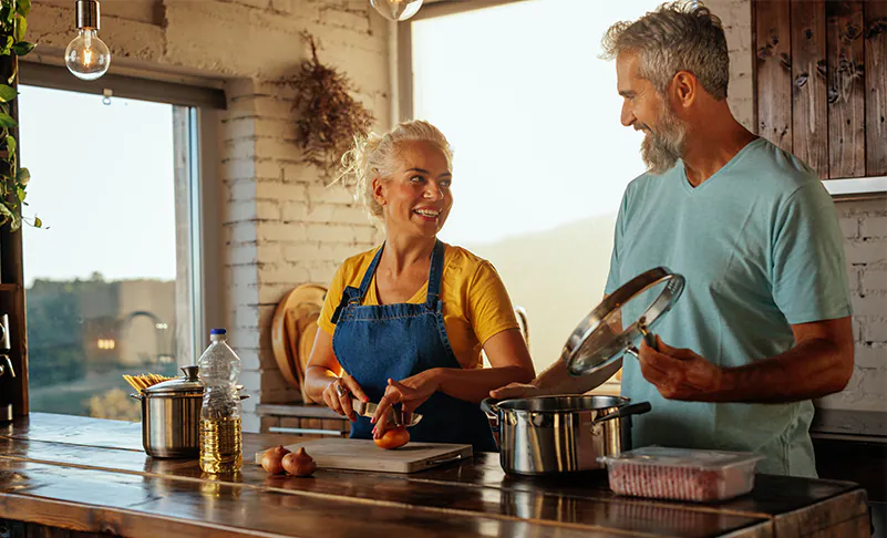 couple cooking together during the evening