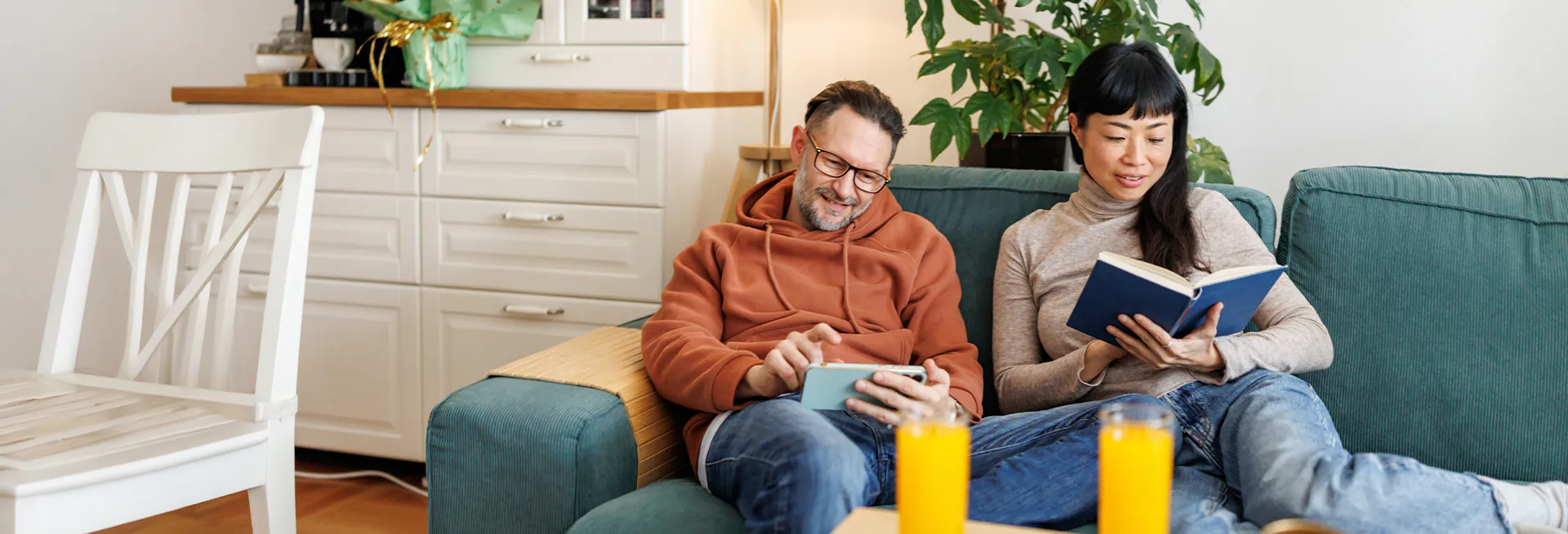 couple at home reading on couch